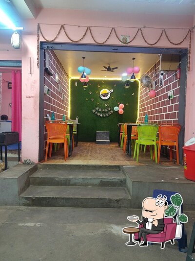 Take a seat at one of the tables at MOMO'S HEAVEN Indian desi Chinese
