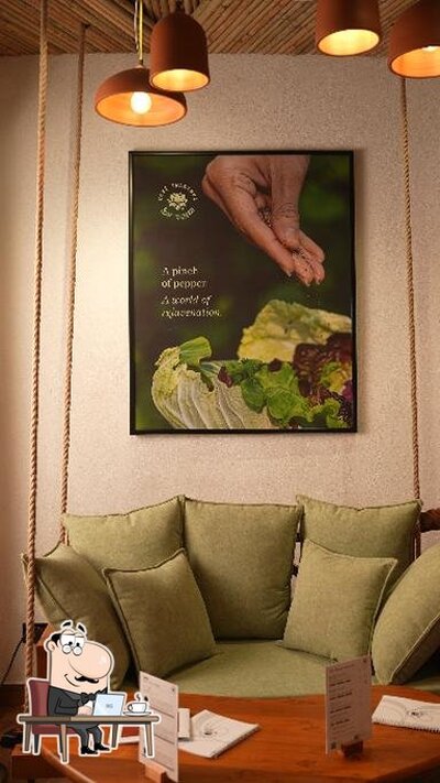 Take a seat at one of the tables at Café Swasthya