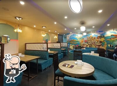 Take a seat at one of the tables at SIGDEE Restaurant