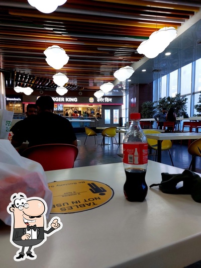 Take a seat at one of the tables at Food Court