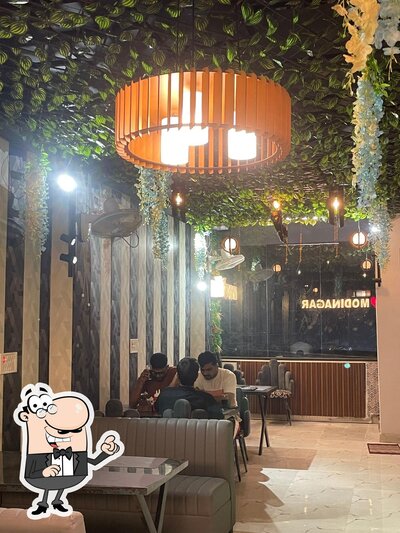 Take a seat at one of the tables at Grand 9 Cafe And Restaurant