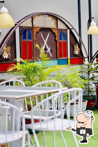 Take a seat at one of the tables at Raada Resto And Cafe