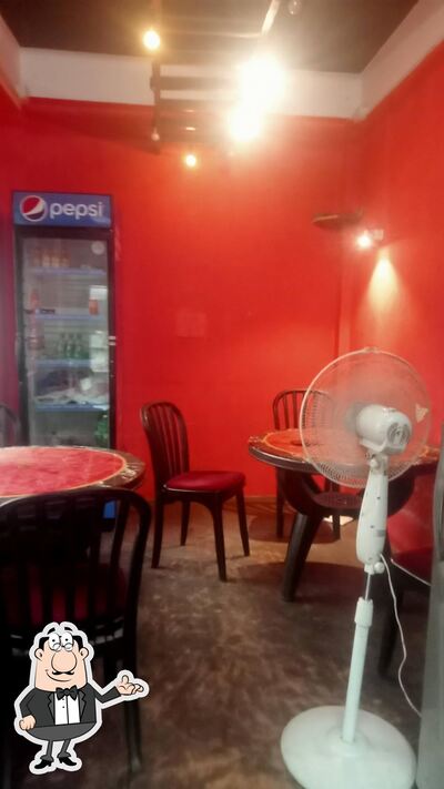 Take a seat at one of the tables at Wow Pork