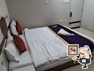 Take a seat at one of the tables at Hotel Corporate Inn Best 3 Star Hotels in Patna