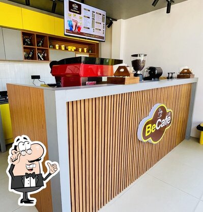 Take a seat at one of the tables at Be Cafe