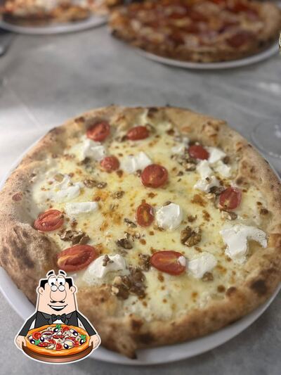 A Pizzeria Dai Butei, puoi prenderti una bella pizza