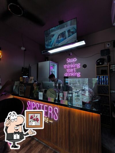 Take a seat at one of the tables at SIPSTERS