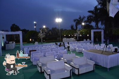 Take a seat at one of the tables at Hotel Chandan Inn