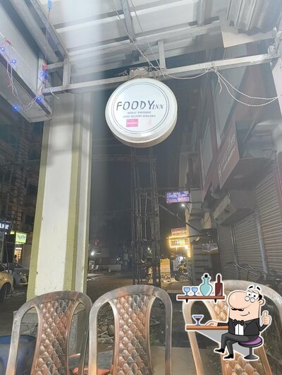 Take a seat at one of the tables at FOODY INN
