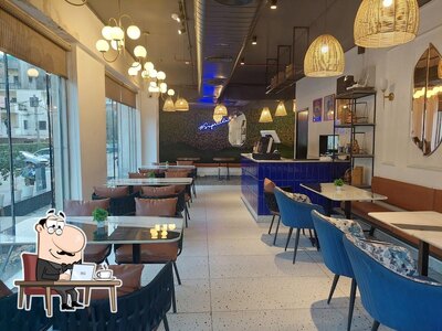 Take a seat at one of the tables at Super chai
