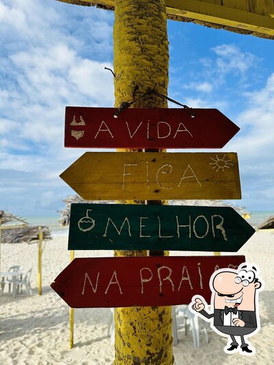 Sente em uma das mesas no Barraca da Telma