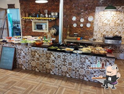 Sente em uma das mesas no Rancho Da Vovó - Restaurante E Café Colonial