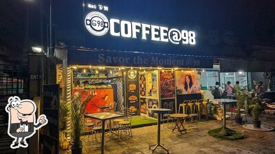 Take a seat at one of the tables at Coffee@98 - Navalur