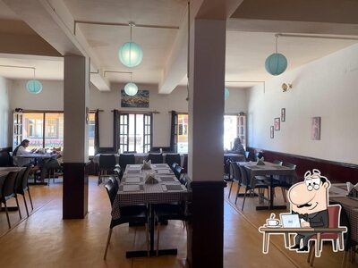 Take a seat at one of the tables at Asian Corner Restaurant