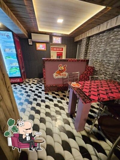 Take a seat at one of the tables at Al Baik