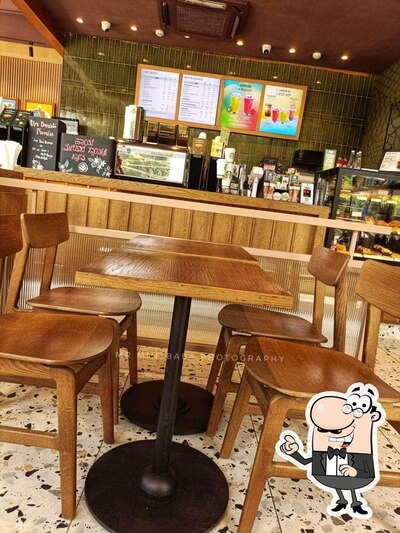 Take a seat at one of the tables at Starbucks