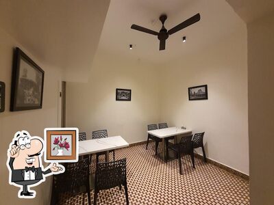 Take a seat at one of the tables at Kitchen 1970s Warangal
