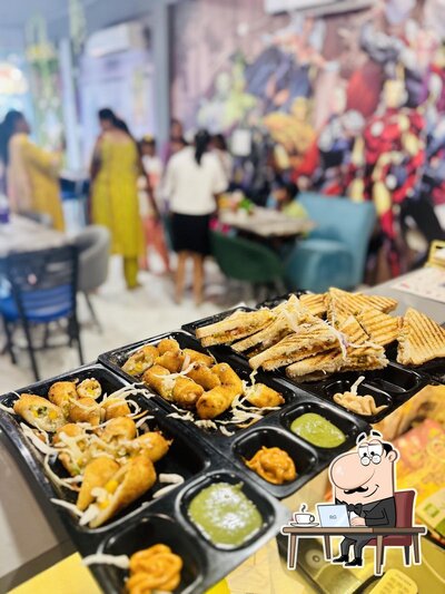 Take a seat at one of the tables at Cuddles Wid Food