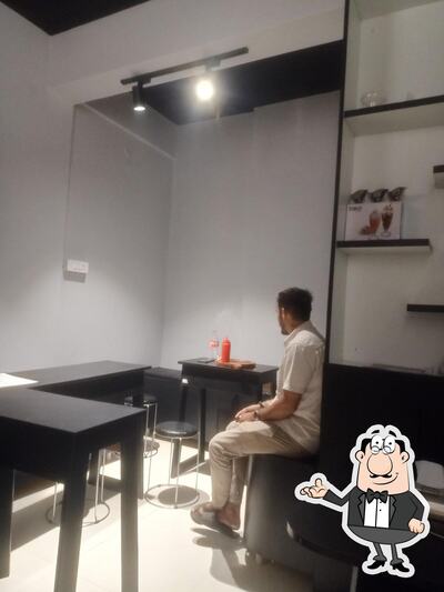 Take a seat at one of the tables at Cafe 89