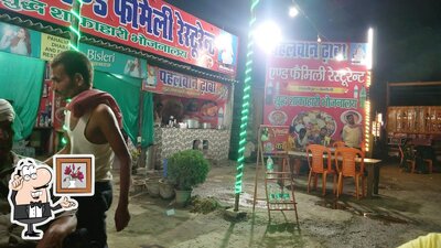 Take a seat at one of the tables at पहलवान ढाबा, रेस्टोरेंट