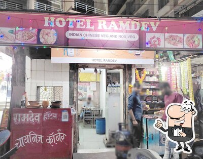 Take a seat at one of the tables at Ramdev