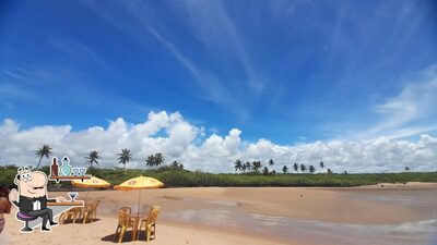 Sente em uma das mesas no Barraca do Boca Rica
