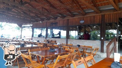 Sente em uma das mesas no Pesque Pague Restaurante Dovale