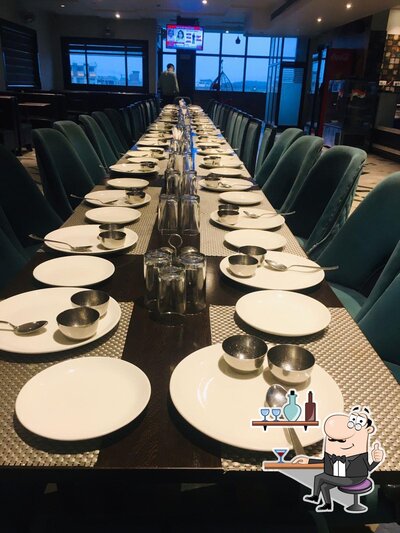 Take a seat at one of the tables at The Ritu's Restaurant