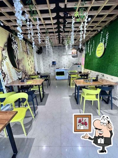 Take a seat at one of the tables at Momo Magic Cafe