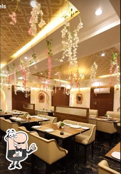 Take a seat at one of the tables at Shohrat Multicuisine Restaurant