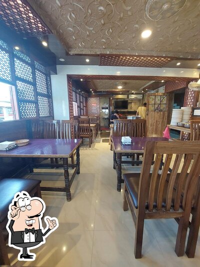 Take a seat at one of the tables at Hashim Restaurant
