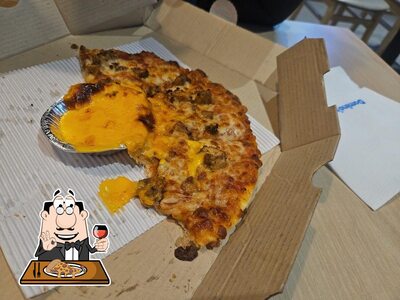 At Domino's Pizza Shillihar, Bhuntar, you can try pizza