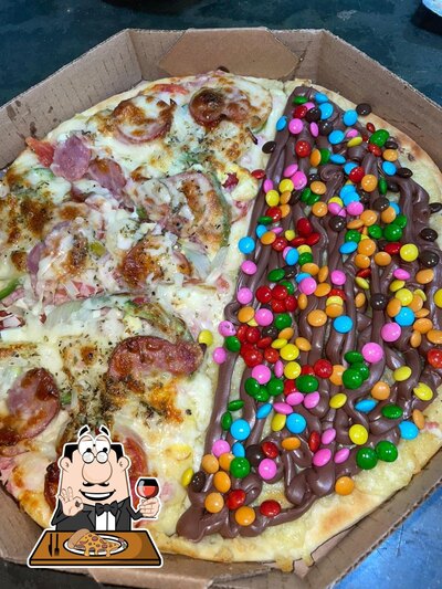 No Pizzaria e Lanchonete do Roque, você pode desfrutar de pizza