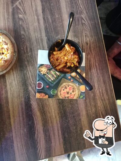 Take a seat at one of the tables at Pizza Classic
