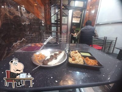 Take a seat at one of the tables at GOLDEN BARBECUE