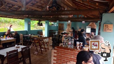 Sente em uma das mesas no CURRAL RESTAURANTE