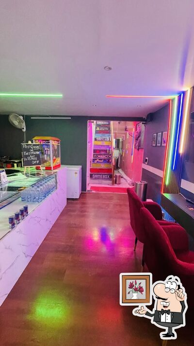 Take a seat at one of the tables at GAME BOX. GAMING CAFE