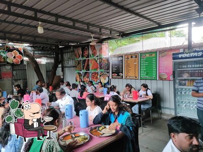 Take a seat at one of the tables at Vaishnavi South Indian Food