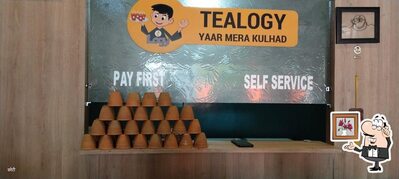 Take a seat at one of the tables at Tealogy Cafe Rajendra Nagar
