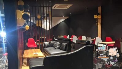 Take a seat at one of the tables at Chai Sutta Bar